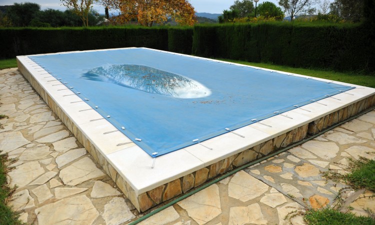 56704171 - pool with a tarp for protection in winter
