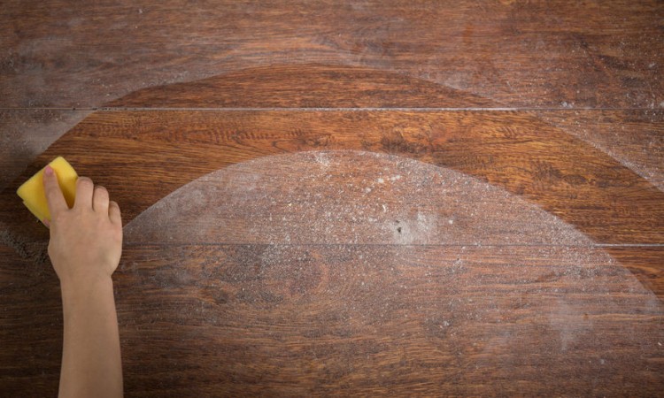 37416732 - photo of woman's hand cleaning the wooden floor